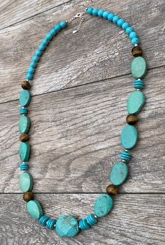 Turquoise Magnesite, Agate & Sterling Silver Statement Necklace Genuine Turquoise Magnesite Genuine Agate Sterling Silver Lobster Claw Clasp Crafted and Finished by Hand Approximate Measurements: Length 30" Adjustable with 2" Extender Live your best life when you are wearing this powerful gemstone statement necklace. This necklace will pair perfectly layered over a turtleneck or tunic or pair with a V-neck t-shirt and a pair of jeans. Handmade Turquoise Agate Beaded Necklaces, Amazonite Necklace With Natural Stones, Chrysoprase Jewelry With Natural Stones For Jewelry Making, Turquoise Gemstone Beads For Jewelry Making, Turquoise Gemstone Necklaces With Round Beads, Green Turquoise Long Necklace With Gemstone Beads, Turquoise Jewelry With Round Natural Stone Beads, Blue Chrysocolla Necklace With Stones, Artisan Chrysocolla Jewelry With Polished Beads