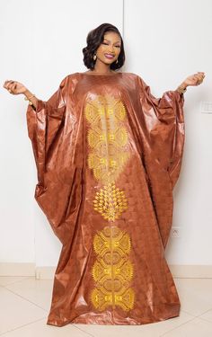 Description: This magnificent custom African dress is perfect for any occasion you want to look your best.  Important Note: For broderie mix with bazin and garniture mix clothes only: Depending on the availability of the( fabric) / Garnitures (TRIMS) may be different than the one in the pictured. However, the dress will be sewn exactly in the style and colors shown. You can always request to see the fabrics or trims before we start by sending us a message along with your order. PROCESSING: We usually take 6- 8 BUSINESS DAYS to make the dress. SHIPPING: We use DHL shipping with tracking and text update. (3 to 5 days) SIZING: What we need from you We have a sizing Chart in the images. Scroll to the right. (Providing your desire measurements for proper fitting ) BUST WAIST HIP SHOULDER SLEEVE Traditional Gold Dresses For Celebration, Elegant Yellow Dress For Celebration, Elegant Brown Embroidered Dress, Gold Dress With Gold Embroidery For Celebration, Gold Long Sleeve Dresses With Gold Embroidery, Fitted Gold Kaftan With Gold Embroidery, Elegant Embroidered Brown Dress, Senegalese Eid Outfits, Festive Brown Embroidered Dress