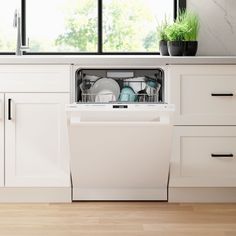 an empty dishwasher in a white kitchen