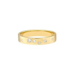 a gold ring with three diamonds on it