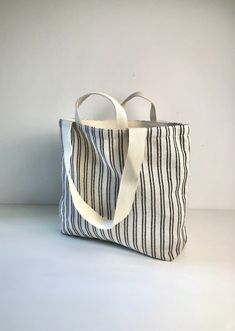 Medium Shopping Bag, Grocery, Weekender, beach, carry all, cotton/stripes. -- 100% natural, medium weight cotton fabric, cotton comfy strap. -- measures 13.75" x 5.10" x H 13.40" (35 x 13 x H 34 cm). -- The long/short handle.  this bag has a Long Shoulder Strap and Short Handle.  No matter how you want to carry it, it gives you the most utility, and comfort. -- two inner pockets for your wallet, cell phone, and more.  -- easy care, Foldable & washable. It is easy to place this bag in the handbag, backpack, kitchen drawer to save space. It can be washed and reused at will. -- choose a stylish and environmentally friendly cotton bag to protect our planet. -- Multipurpose. This bag can be used as groceries, baked goods, books, clothing, etc.. Can also be used as weekend tote bag,  for travel, Casual Striped Beach Bag, Natural Cotton Canvas Beach Bag, Striped Tote Beach Bag For Everyday, Everyday Striped Tote Beach Bag, Travel Bags With Striped Cotton Material, Travel Bags With Striped Cotton Design, Casual Striped Beach Bag For Everyday Use, Everyday Striped Canvas Bag, Striped Cotton Travel Bags