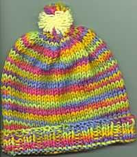 a multicolored knitted beanie hat on a white background