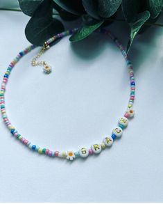 Cute pastel beaded necklace, Daisy necklace, personalised necklace for kids. choose from 9 different colours.  These beautiful beaded necklaces are approx 13 inches in length and are adjustable up to around 15 inches.  Handmade by me in West Sussex! Not suitable for children under 3, keep dry to maintain quality. Name Beads Necklace, Kids Beaded Necklace, Beaded Name Necklace, Kids Jewellery, Beautiful Beaded Necklaces, Girls Necklace, Personalised Necklace, Pastel Beads, Daisy Necklace