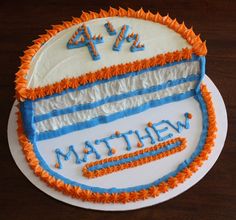 a cake that is on top of a plate with the name math written in blue and orange frosting