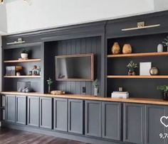 a living room filled with lots of gray furniture