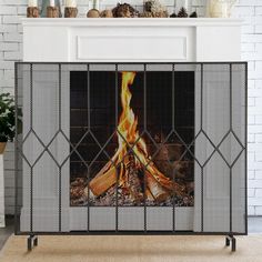 a fireplace screen with a fire in it