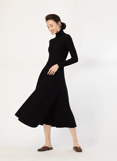 Embrace elegance with a touch of comfort in our Ribbed Turtleneck Midi Sweater Dress, perfect for making a subtle statement.
Crafted from a soft blend of polyester, viscose, and nylon, this dress balances warmth and a gentle stretch. The sleek ribbed knit accentuates your figure, while the high collar and long sleeves offer sophistication and cozy coverage. Maximizing comfort, the flexible ribbed fabric and midi-length, flared skirt move with you, showcasing its uncomplicated yet refined style.
A versatile companion, this sweater dress transitions smoothly from office hours to evening outings. Pair it seamlessly with boots for a powerful day look or add heels and accessories to transform it for a night out. The dress's simplicity is its strength, making a dignified impression in every sett Midi Sweater Dress, Simplicity Dress, Refined Style, Ribbed Turtleneck, Knitwear Dress, Sweater Dress Midi, Women Hoodies Sweatshirts, Flared Skirt, Ribbed Fabric