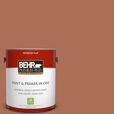 a can of behr paint on a gray background