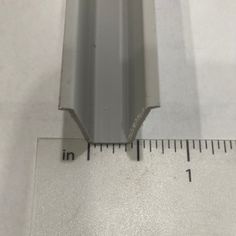 a measuring tape is next to an aluminum strip