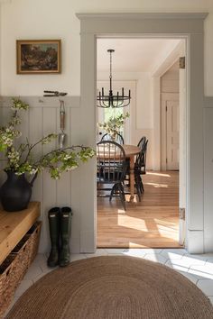 an open door leading into a dining room