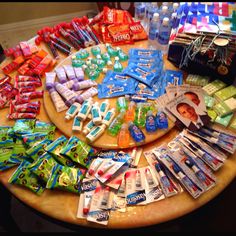 a round table topped with lots of different types of toothpaste on top of it