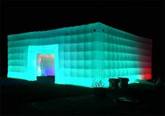 an inflatable structure lit up at night