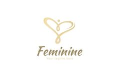 the feminine logo is shown in gold and white with a heart shaped drop on it