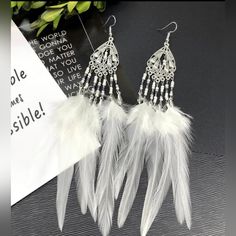 Handmade Feathered Earrings Super Sale White Feather Dangle Earrings, White Festival Earrings For Pierced Ears, Bohemian White Chandelier Earrings For Festivals, Adjustable White Feather Jewelry, Elegant White Chandelier Earrings For Summer, White Chandelier Earrings For Festival, Elegant Feather Earrings For Festival, White Elegant Chandelier Earrings For Festivals, Elegant White Feather Earrings