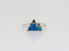 Vintage Sterling Silver Blue Opal Mountain Ring...Marked 925...Total of weights 1.4grams... Size 7...Measure of Face 9.5MM...It's in very good condition. B Blue Sterling Silver Opal Promise Ring, Blue Opal Ring Stamped 925 For Gift, Mountain Ring, Blue Opal, Silver Blue, Ring Size 7, Vintage Sterling Silver, Opal, Enamel Pins