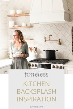 a woman standing in the kitchen next to an oven