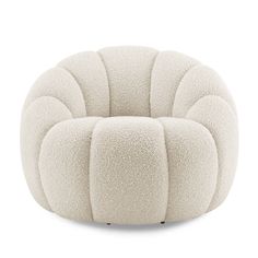 a white chair that is made out of foam and has four circles on the back