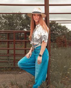 Get your country vibe on with the Tombstone Ghostown Cropped Pearl Snap. A nod to the Wild West with its cropped length and pearl snap buttons. Designed with a loose fit for comfort and unique cattle brand details for a touch of individuality. Giddy up!(Yeehaw!) Medium Wash Bottoms For Spring Rodeo, Casual Bottoms For Ranch In Fall, Women Pearl Snap Outfit, Western Style Spring Tops With Buttons, Spring Tops With Pockets For Rodeo, Casual Bottoms For Rodeo In Spring, Casual Spring Bottoms For Rodeo, Western Style Denim Bottoms For Spring, Rodeo Tops With Snap Buttons In Relaxed Fit