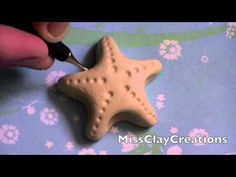 a person is cutting into a star shaped cookie