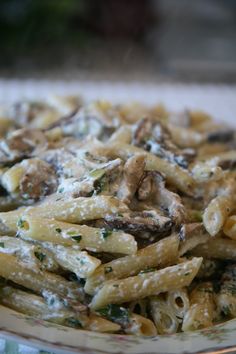 pasta with mushrooms and spinach on a plate