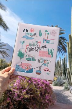 bobo design studio's hello palm springs art print held up with palm springs in the background