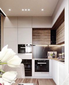 a modern kitchen with white and wood decorating the walls, flooring and cabinets