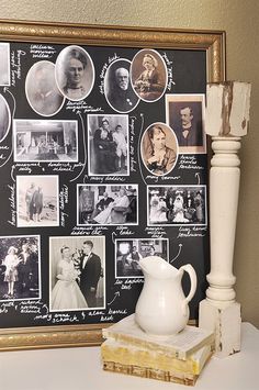 a white vase sitting on top of a table next to a black and white wall