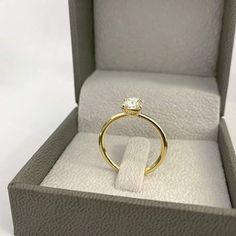 an open box with a ring in it