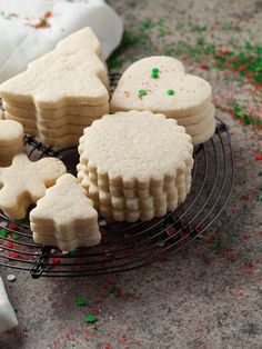 some cookies on a wire rack with sprinkles