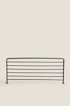 a black metal fence is shown against a white background