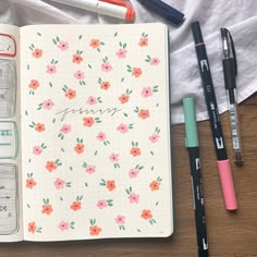 an open notebook with flowers and writing on it