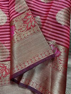 Gorgeous Maheshwari handloom Saree in Silk Cotton soft material with Meenakari Work. Borders have Black as well. Body of the saree has Zari Buttas.  Simple and Elegant - Style it will any traditional jewelry  Item: Saree Color : Wine and Mauve Pink  Base Fabric: Maheshwari  Cotton Silk . Super soft & Light material.  Blouse piece : Comes with Blouse piece. Blouse material: Maheshwari Cotton Silk  Work: Zari Weaving and tassels attached  Fall & Edging:  Come with Fall and edging (Pico) Disclaimer -: - Color variation is possible due to various reasons like phone or desktop setting, resolution etc. Please don't hold us responsible. Our aim is to put the exact color of the Saree. - If the Saree is Pure Silk, we will put it very clearly in our listing that it is Pure Silk. If we do not mention Celebration Raw Silk Saree With Zari Weaving, Handloom Tussar Silk Saree For Celebration, Tussar Silk Handloom Saree For Celebration, Handloom Chanderi Saree For Celebration, Celebration Chanderi Saree With Zari Weaving, Navratri Anarkali Dupatta With Weaving Work, Handloom Saree For Navratri Celebration, Navratri Celebration Handloom Saree, Transitional Banarasi Silk Handloom Traditional Wear