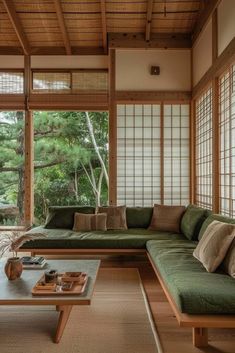 a living room filled with furniture and windows