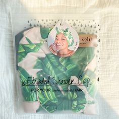 the package is packed with an image of a woman's face and green leaves