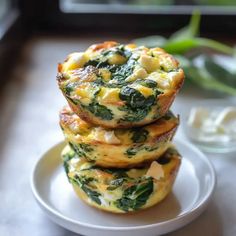 three muffins stacked on top of each other on a white plate next to a green plant