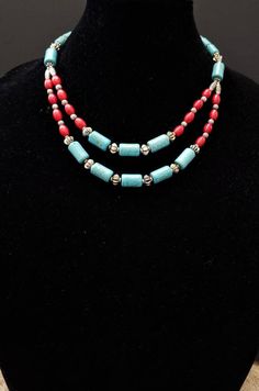 Look so elegant in this beautifully detailed Tibetan multistrand necklace in a pretty sky blue color. Made of howlite beads in a realistic imitation turquoise and coral pattern. Detailed silver colored spacer beads. Can be worn with anything - dress up or casual. Traditional, yet modern. Looks amazing with blue jeans and a white shirt. Looks far more expensive than it is! When worn, the first strand falls at 8 in, the second at 9 in. find even more awesome necklaces here: https://www.etsy.com/sh Handmade Double Strand Turquoise Necklace, Bohemian Turquoise Beaded Necklaces In Red Coral, Bohemian Red Coral Beaded Necklace In Turquoise, Bohemian Turquoise And Red Coral Beaded Necklaces, Bohemian Turquoise Beaded Necklace With Red Coral, Bohemian Turquoise And Red Coral Beaded Necklace, Bohemian Turquoise Necklace With Red Coral, Spiritual Multi-strand Turquoise Necklace Gift, Bohemian Turquoise And Red Coral Necklaces