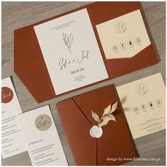 the wedding stationery is laid out on top of each other