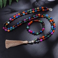 Beaded -8mm Colorful Striped Agate Beads and Knotted Japamala Necklace Meditation Yoga Blessing Jewelry Set 108 Mala Rosary Style: Classic Shape\pattern: Round Pendant Size: 8CM Occasion: Party Necklace Type: Pendant Necklaces Metals Type: Tibetan silver Material: Semi-precious Stone Item Type: Necklaces Gender: Unisex Function: fitness tracker,sleep tracker,Mood Tracker Fine or Fashion: Fashion Model Number:3256803231721221 Spiritual Agate Beaded Bracelets With Colorful Beads, Bohemian Multicolor Beaded Necklace, Adjustable Multicolor Crystal Necklace With 8mm Beads, Bohemian Multicolor 8mm Beads, Bohemian Multicolor Crystal Necklace With 108 Beads, Multicolor Necklaces With 108 Beads For Healing, Multicolor Bohemian Hand-strung Crystal Necklaces, Bohemian Mala With Colorful Beads For Meditation, Multicolor Agate Beaded Bracelets With Colorful Beads