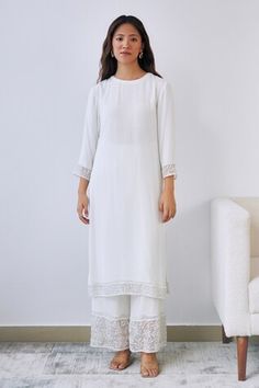 White georgette kurta with beaded embroidered panels. Comes with pant and an organza dupatta. - Aza Fashions Elegant White Kurta With Embroidered Border, Festive White Embellished Kurta, Reception Georgette Sets With Embroidered Border, White Georgette Sets With Embroidered Border, Elegant White Embellished Kurta, White Cutwork Dress For Festive Occasions, Festive White Cutwork Dress, Festive White Dress With Cutwork, Elegant Georgette Dress With Embroidered Border