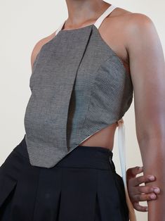 The Deonn Halter is a geometric shaped top with adjustable tying straps. Deonn is versatile and can be worn year round through all seasons. Wear as is for a sexy and flirty vibe, or with a short or long sleeve top underneath for a layered look. .. Backless halter top with adjustable tying straps in the back .. Geometric shape with front panel .. Lined with ivory linen fabric .. Features flat or round ivory tying straps .. Limited fabric, restock unavailable Backless Halter Top, Halter Tops, Layered Look, British Indian, Bosnia And Herzegovina, Halter Top, All Seasons, Linen Fabric, Long Sleeve Top