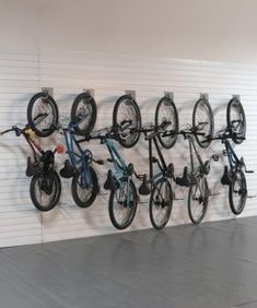 there are many bikes hanging on the wall