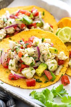 two tortillas with shrimp, tomatoes and cilantro