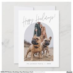 two dogs standing next to each other in front of a white card with the words happy holidays