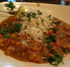 a white plate topped with rice and beans