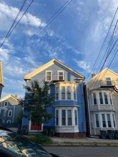 a car is parked in front of some houses