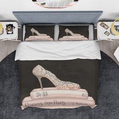 a bed with high heel shoes on it and the words queen's from paris