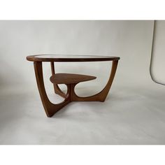 a wooden table sitting on top of a white floor