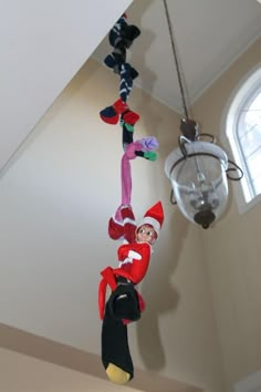 the elf is hanging from the ceiling in the house