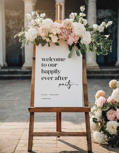 a welcome sign with flowers on it