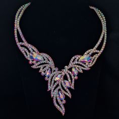 This is a brilliant necklace of unique beauty  From unusually sparkling rhinestones.  The design and base was invented and made by designer Svetlana Zralko using a unique technology and does not cause allergies.  Surface and reverse side covered with fabric.  Perfectly executed smooth lines and curves, magnificent fittings speak of the high quality of the product!  This necklace will serve you for a very long time and will delight you and delight others at any holiday! Convenient necklace for pe Crystal Jeweled Bridal Necklace In Costume Style, Evening Crystal Jeweled Necklaces, Crystal Bridal Necklace With Jeweled Costume Jewelry, Evening Jeweled Crystal Necklace, Evening Crystal Necklace, Party Costume Jewelry Bridal Necklace, Costume Jewelry Crystal Necklace With Rhinestones, Dazzling Jeweled Crystal Bridal Necklace, Dazzling Jeweled Bridal Necklace In Crystal